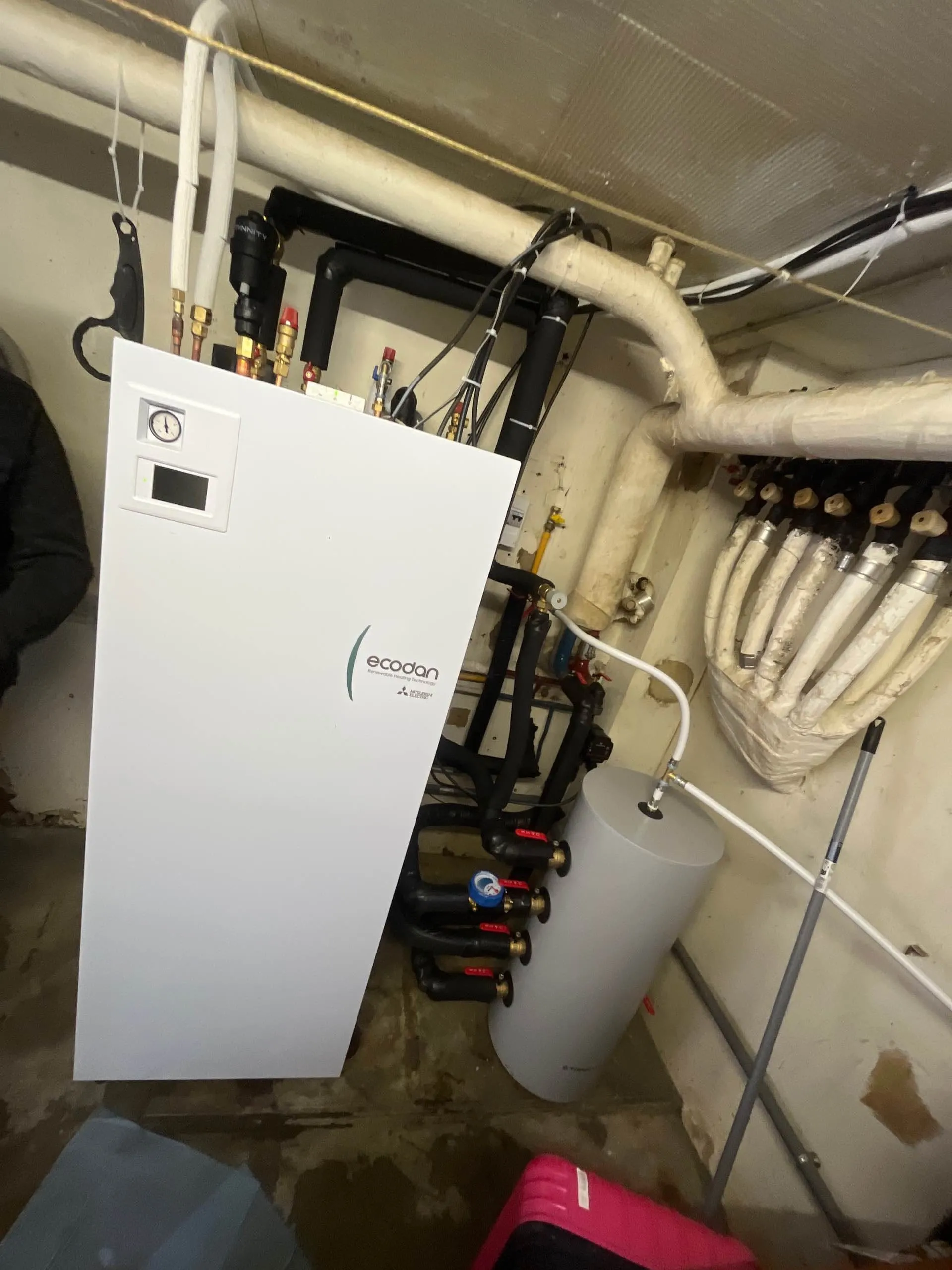 Neat indoor installation of a Mitsubishi Ecodan heat pump module in a home near Chalon-sur-Saône